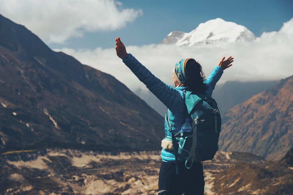 woman, backpack, raised, arms