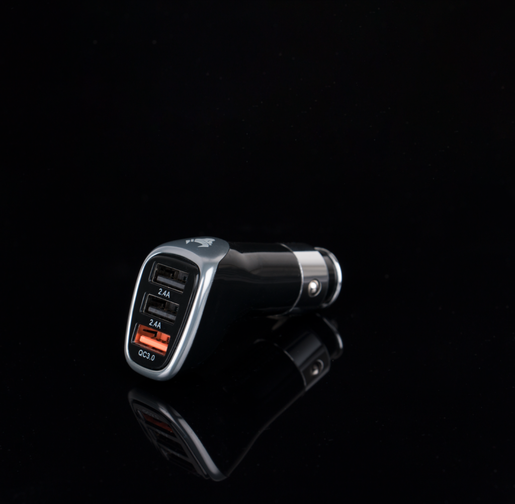 Sleek black car charger featuring multiple USB ports for versatile device charging.